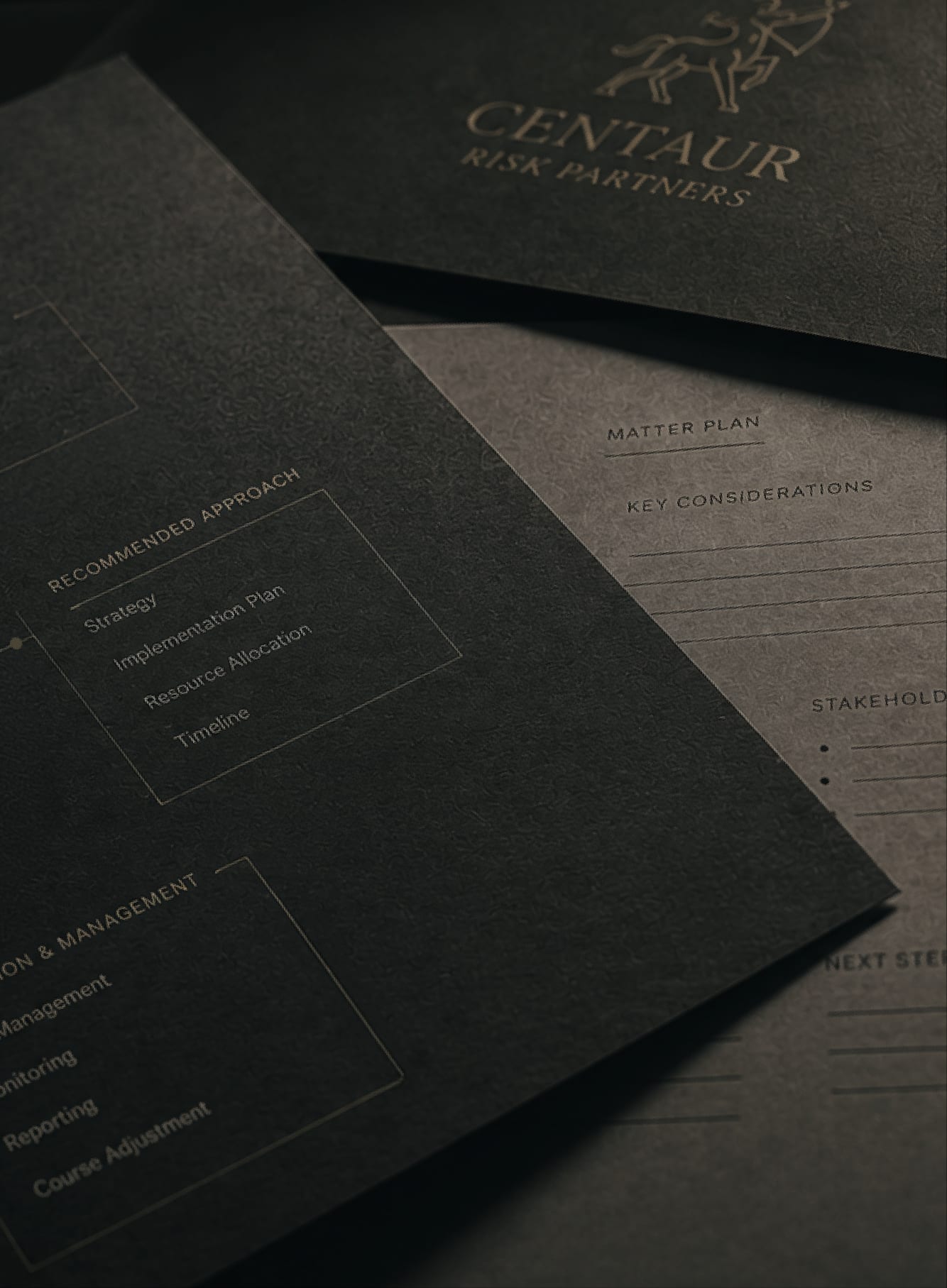 Custom strategy documents on dark surface with the Centaur Risk Partners mark